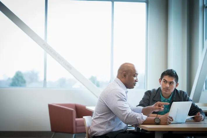 a coatch is helping A man Creating a Sustainable Plan for Change